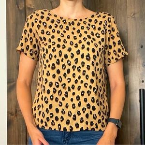 Cheetah blouse, that you can dress up or keep it casual and still look cute.